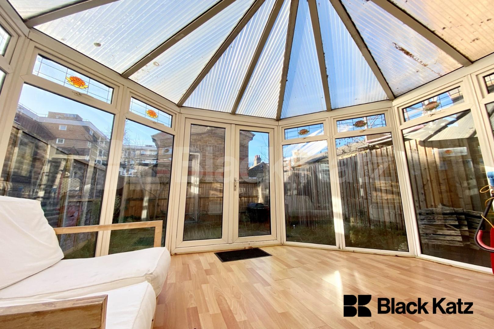 Two bedroomed house with study room, conservatory, parking & charming garden   Kinburn Street, Rotherhithe/Canada Water. 